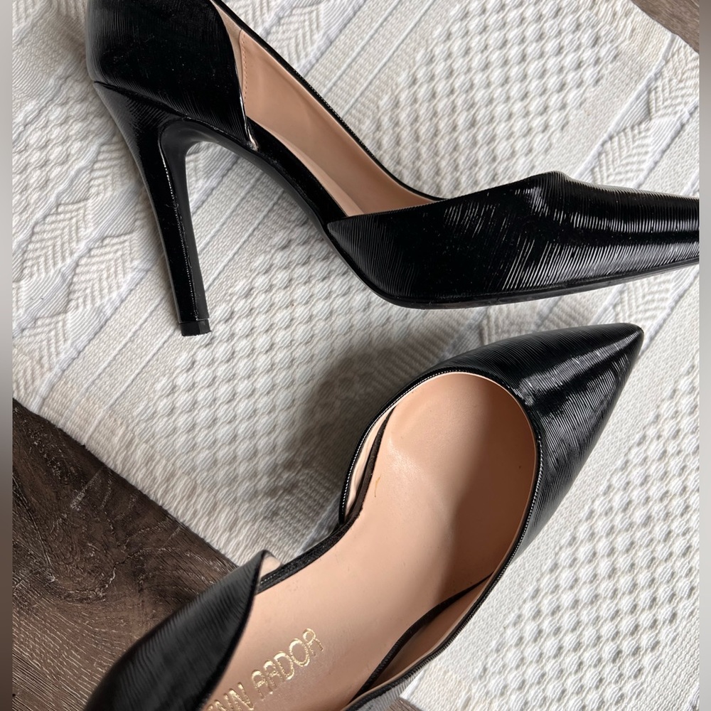 Black high heel shoes. Patent leather looking with a shine and 4” heel